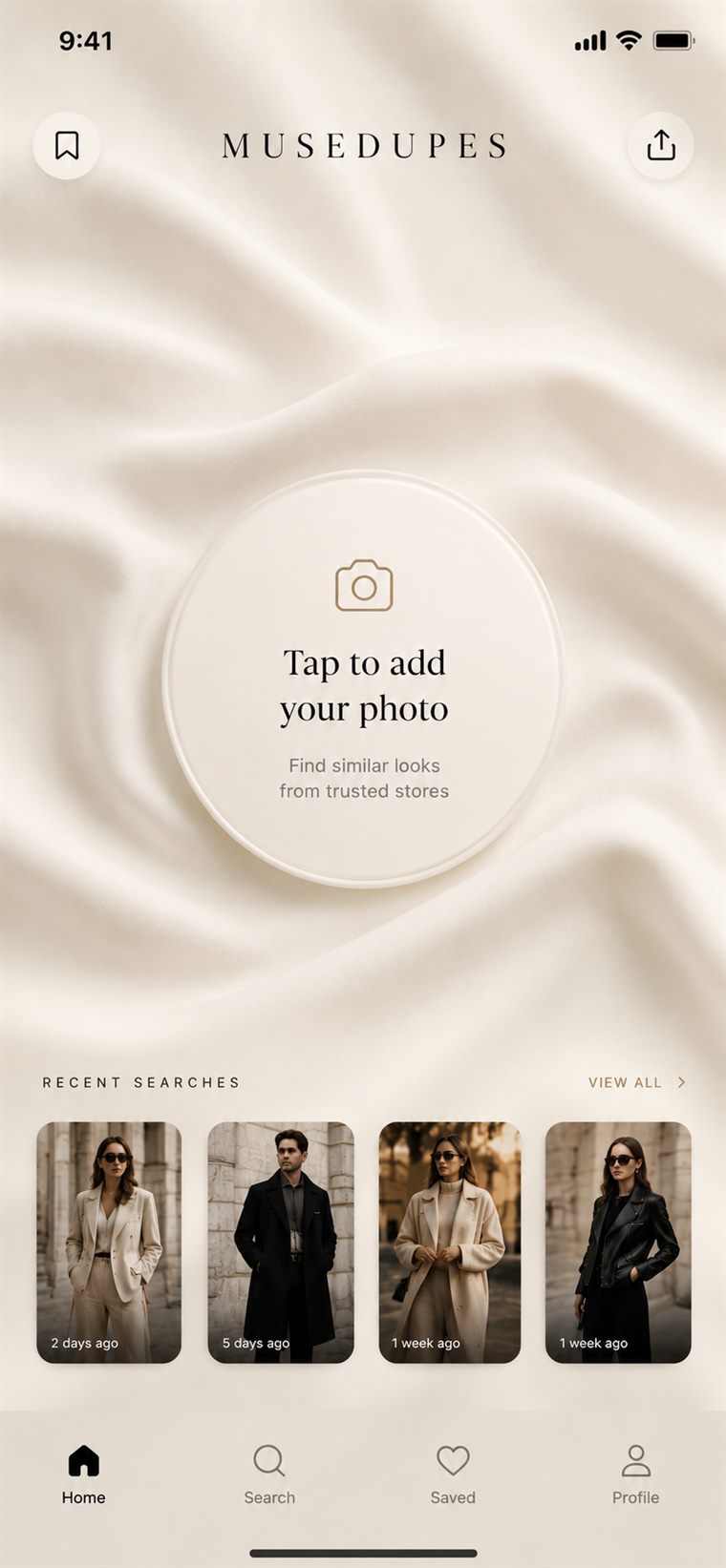 Preview of the MuseDupes app home screen: an ivory silk background with a circular “Tap to add your photo” button and a row of recent outfit searches.